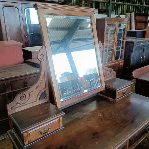 36 - An early 20th century mahogany dressing table, with two frieze drawers, 109 cm wide<br /><br />Pleas...