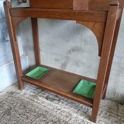 59 - An oak hall stand, with a tiled back, 77 cm wide<br /><br />Please note collection is from TA9 4LJ o...