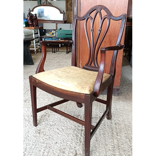 62 - A mahogany armchair, with a carved and pierced splat back, drop in seat and square tapering legsPlea... 