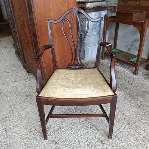 62 - A mahogany armchair, with a carved and pierced splat back, drop in seat and square tapering legsPlea... 