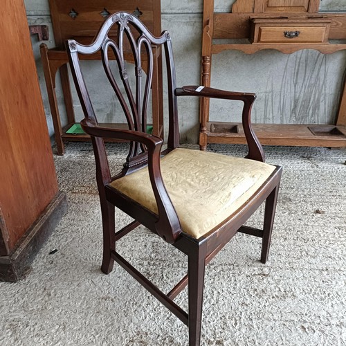 62 - A mahogany armchair, with a carved and pierced splat back, drop in seat and square tapering legsPlea... 