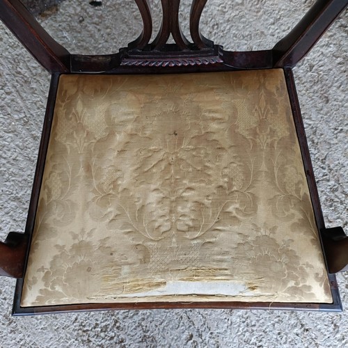 62 - A mahogany armchair, with a carved and pierced splat back, drop in seat and square tapering legsPlea... 