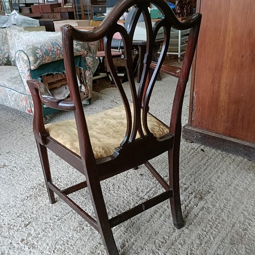 62 - A mahogany armchair, with a carved and pierced splat back, drop in seat and square tapering legsPlea... 