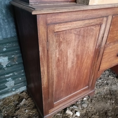 69 - A 19th century mahogany bookcase cabinet, the top with three glazed doors, the base with two drawer ... 