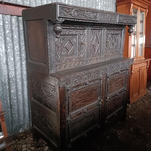 75 - A carved oak buffet, 134 cm widePlease note collection is from TA9 4LJ only on 22nd, 23rd, 24th &... 