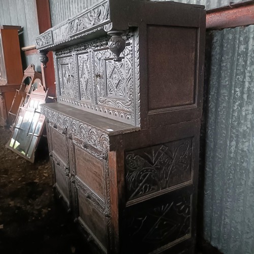 75 - A carved oak buffet, 134 cm widePlease note collection is from TA9 4LJ only on 22nd, 23rd, 24th &... 