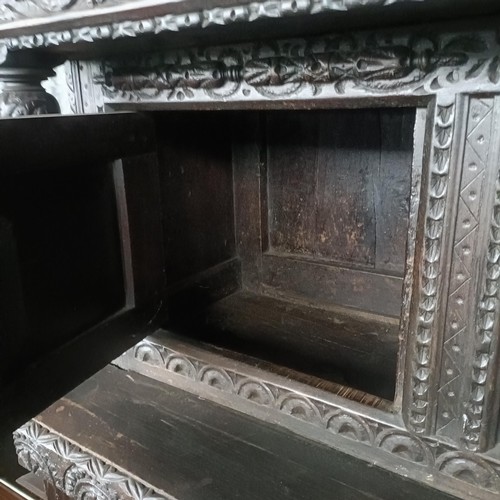 75 - A carved oak buffet, 134 cm widePlease note collection is from TA9 4LJ only on 22nd, 23rd, 24th &... 