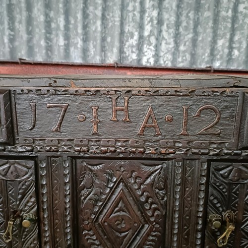 75 - A carved oak buffet, 134 cm widePlease note collection is from TA9 4LJ only on 22nd, 23rd, 24th &... 