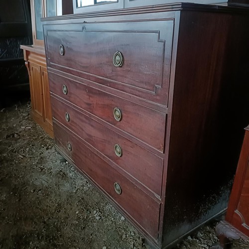 77 - A George III mahogany secretaire bookcase, the top with two glazed doors, above a fitted drawer, and... 