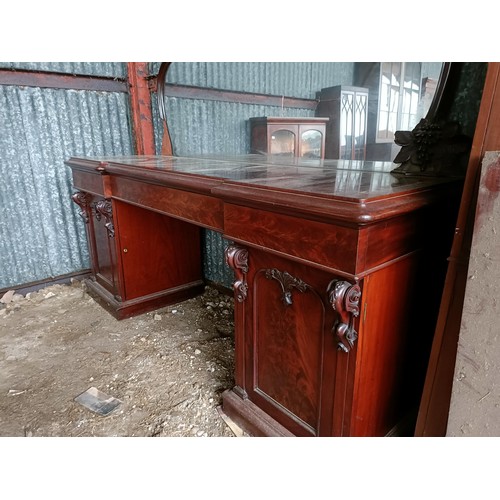 81 - A 19th century mahogany sideboard with a mirrored back, to a base with three drawers, and two cupboa... 