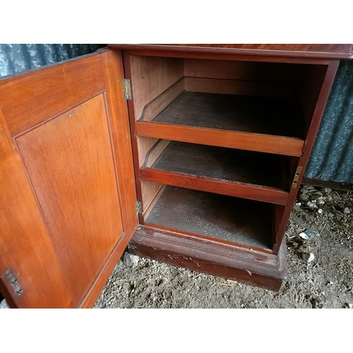 81 - A 19th century mahogany sideboard with a mirrored back, to a base with three drawers, and two cupboa... 