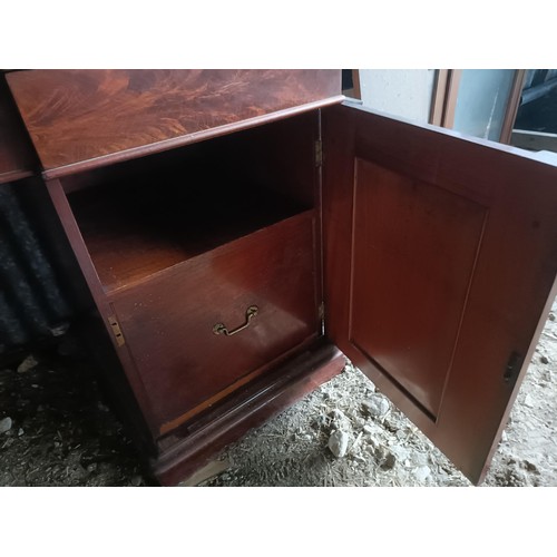 81 - A 19th century mahogany sideboard with a mirrored back, to a base with three drawers, and two cupboa... 