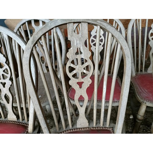 96 - A set of seven wheel back kitchen chairs, and a similar set of five (11)Please note collection is fr... 