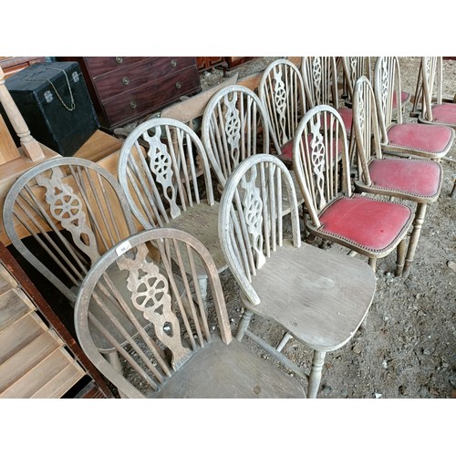 96 - A set of seven wheel back kitchen chairs, and a similar set of five (11)Please note collection is fr... 