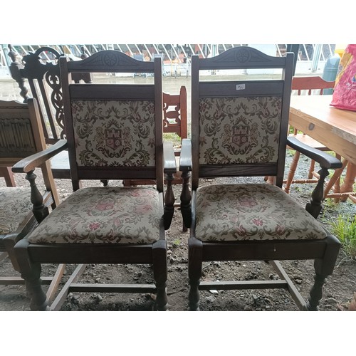 99 - A set of seven oak dining chairs, with carved linen fold backs (2+5)Please note collection is from T... 