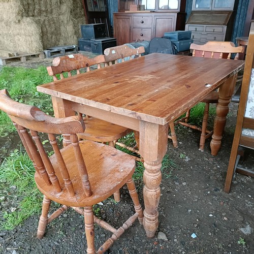 100A - A pine kitchen table, and four pine kitchen chairs (5)Please note collection is from TA9 4LJ only on... 