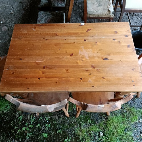 100A - A pine kitchen table, and four pine kitchen chairs (5)Please note collection is from TA9 4LJ only on... 