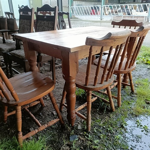 100A - A pine kitchen table, and four pine kitchen chairs (5)Please note collection is from TA9 4LJ only on... 