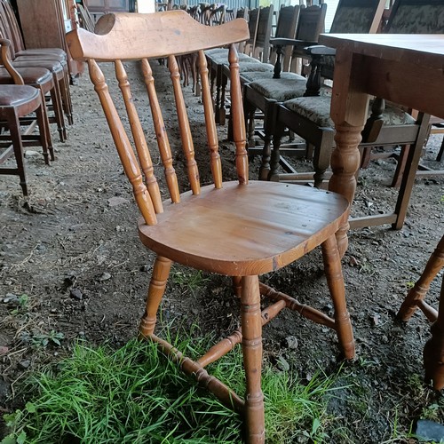 100A - A pine kitchen table, and four pine kitchen chairs (5)Please note collection is from TA9 4LJ only on... 