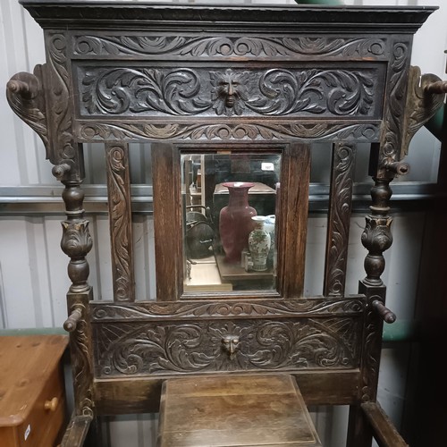 107 - A carved oak hallstand, 110 cm widePlease note collection is from TA9 4LJ only on 22nd, 23rd, 24th &... 