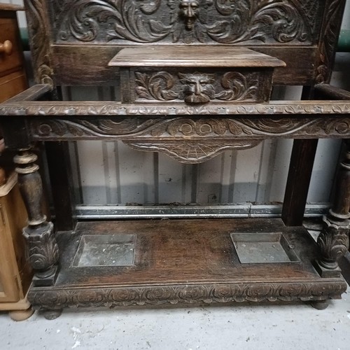 107 - A carved oak hallstand, 110 cm widePlease note collection is from TA9 4LJ only on 22nd, 23rd, 24th &... 