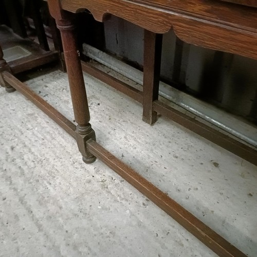 111 - An oak dresser, with three tier plate rack on a base with two drawers, 146 cm widePlease note collec... 