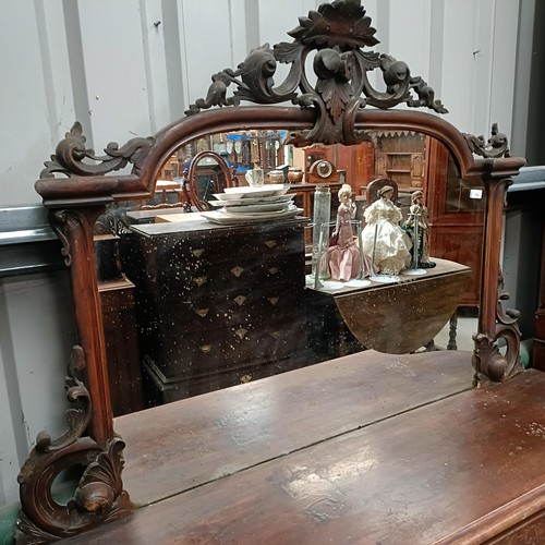 114 - A walnut credenza, with a raised mirrored back, 160 cm widePlease note collection is from TA9 4LJ on... 