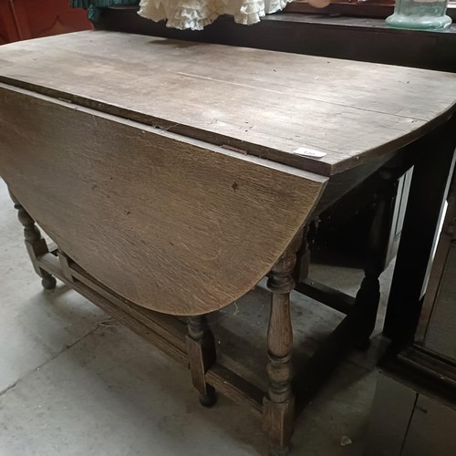 120 - An oak drop leaf table, 120 cm widePlease note collection is from TA9 4LJ only on 22nd, 23rd, 24th &... 