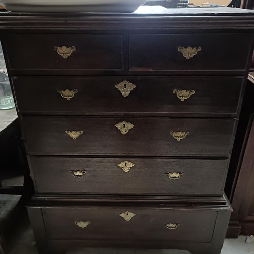 121 - An oak chest on stand, top with two short and three long drawers on a base with a single drawer, 95 ... 