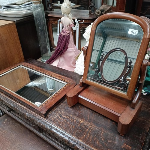 134 - A mahogany bedroom mirror, 40 cm wide, and a walnut framed wall mirror, 37 x 70 cmPlease note collec... 