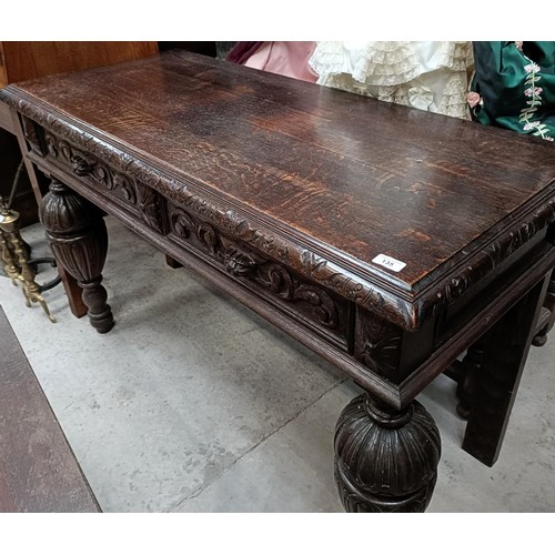 135 - An early 20th century oak side table, with two frieze drawers, on bulbous supports, 127 cm widePleas... 