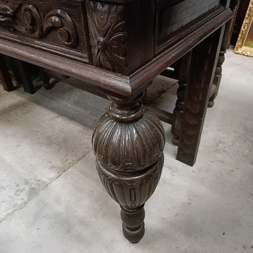 135 - An early 20th century oak side table, with two frieze drawers, on bulbous supports, 127 cm widePleas... 