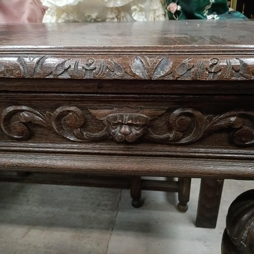 135 - An early 20th century oak side table, with two frieze drawers, on bulbous supports, 127 cm widePleas... 