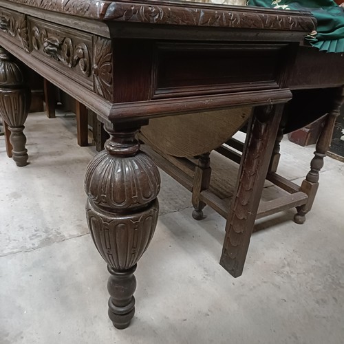 135 - An early 20th century oak side table, with two frieze drawers, on bulbous supports, 127 cm widePleas... 