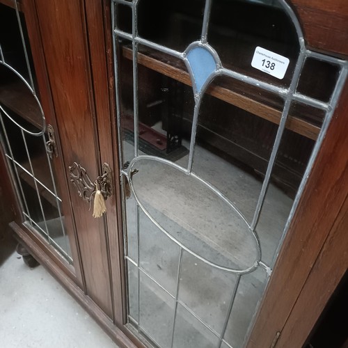 138 - An early 20th century oak bookcase, with leaded glazed doors, 107 cm widePlease note collection is f... 