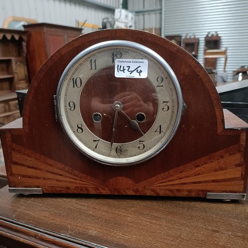 142 - A mahogany glazed bookcase, 97 cm wide, an Art Deco clock and two biscuit barrelsPlease note collect... 