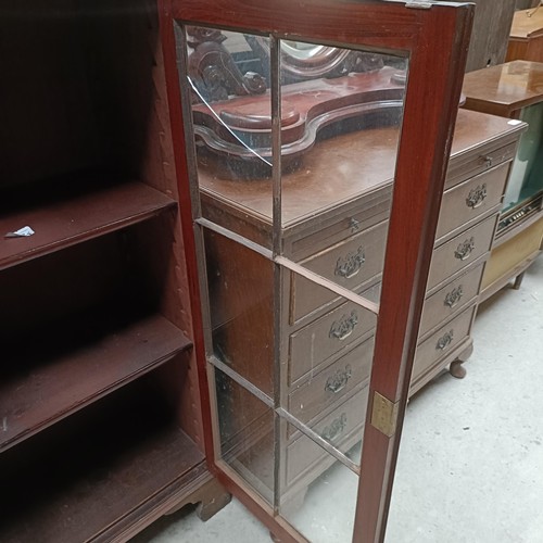 142 - A mahogany glazed bookcase, 97 cm wide, an Art Deco clock and two biscuit barrelsPlease note collect... 