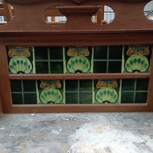 148 - An early 20th century washstand, with a tiled back, marble top with two cupboard doors, 110 cm wideP... 