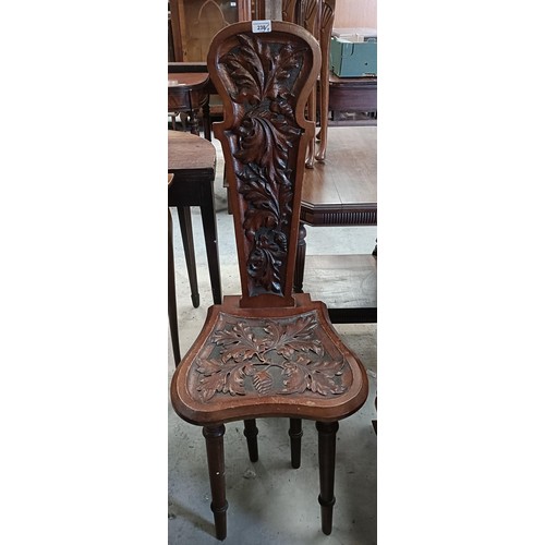 238 - A carved walnut milking stool, with a raised back, and a single chair (2)Please note collection is f... 