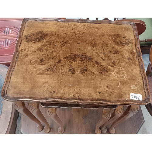 230 - A walnut lamp table, 72 cm wide, and a nest of three tables, 50 cm widePlease note collection is fro... 