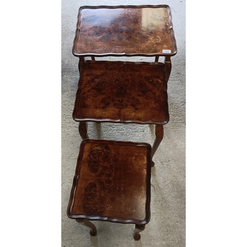 230 - A walnut lamp table, 72 cm wide, and a nest of three tables, 50 cm widePlease note collection is fro... 