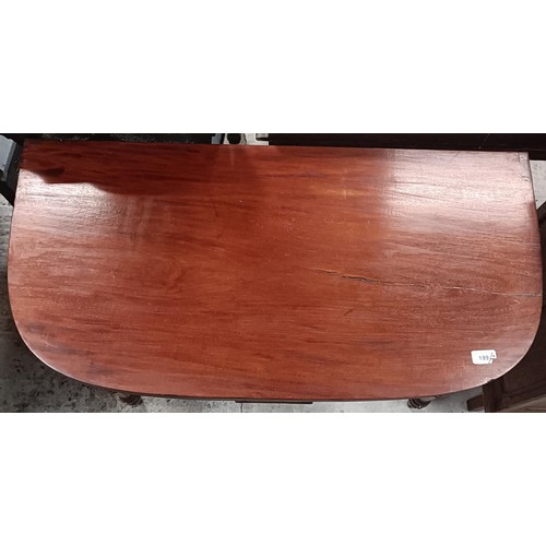 199 - A mahogany folding tea table, 91 cm wide, and an oak filing cabinet, 40 cm wide (2)Please note colle... 