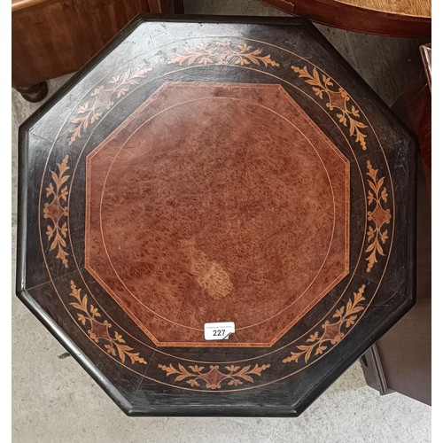 227 - A Victorian octagonal occassional table, with an inlaid top, on turned legs united by an X stretcher... 