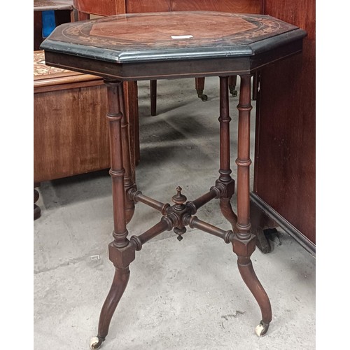 227 - A Victorian octagonal occassional table, with an inlaid top, on turned legs united by an X stretcher... 