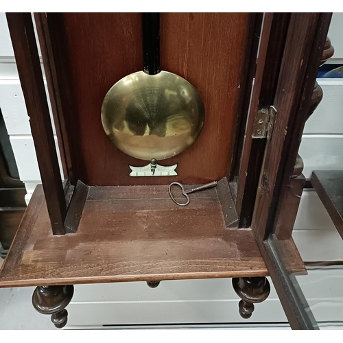 209 - A Vienna regulator style clock, in a walnut case with an eagle finial, 130 cm highPlease note collec... 