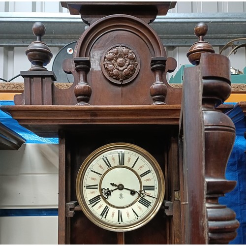 210 - A Vienna regulator style clock, the enamel dial initialled GB, in a walnut case with an eagle finial... 