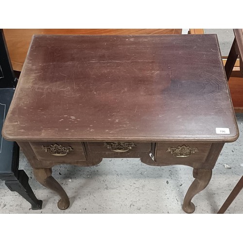 196 - A mahogany lowboy, having three drawers, 70 cm widePlease note collection is from TA9 4LJ only on 22... 