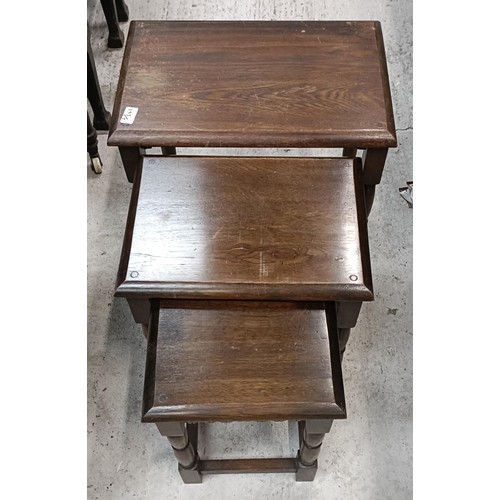 193 - A nest of three Ercol tables, 47 cm wide, another nest of tables and a cabinet (3)Please note collec... 