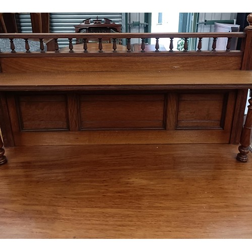 190 - An early 20th century oak chiffonier by Edwards & Sons of Newcastle, with a raised back, the bas... 