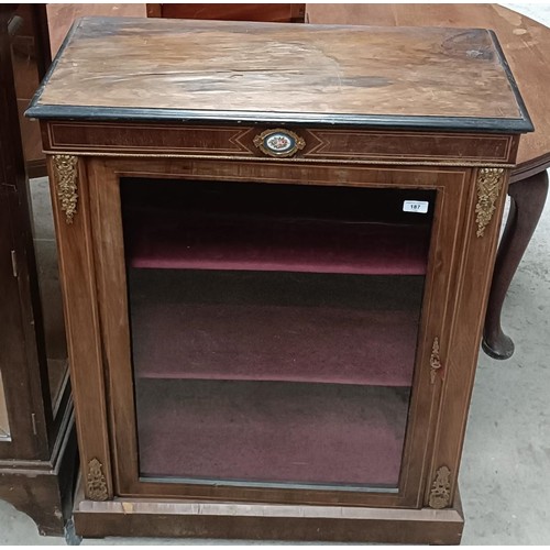 187 - A 19th century walnut pier cabinet, the top rail inset with an oval porcelain plaque decorated flowe... 